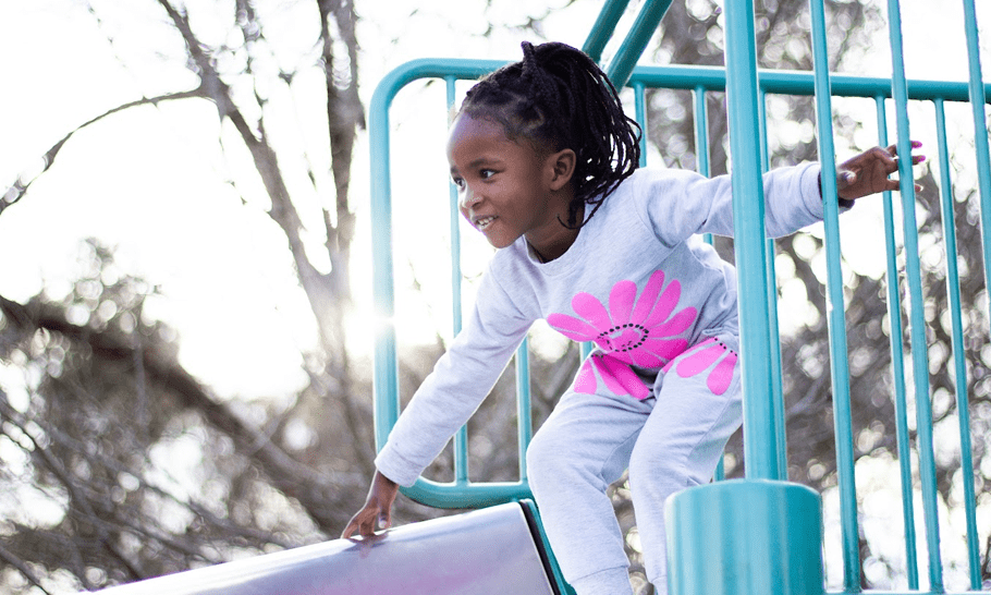 Young child on slide occupational therapy physical play
