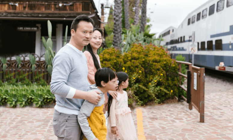 Happy family walking together outside