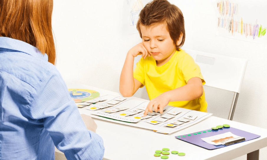 Clinical Professional reviewing evaluation with child